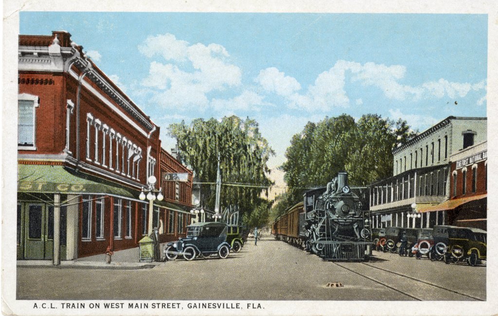 A train traveling down Main Street in Gainesville circa 1925